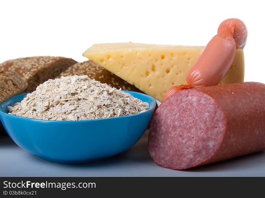 Bread,  cheese and sausage on a white background