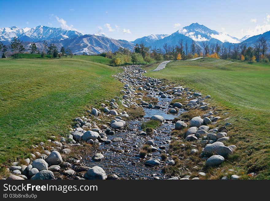 Golf meadow landscape. Almaty city.