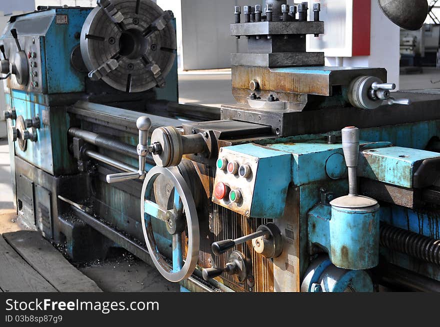 Old metal machines - lathe. Industrial workshop.