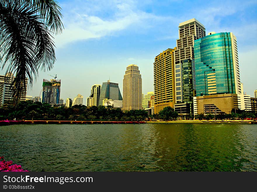 Cityscape of many buildings and reflection in lake. Cityscape of many buildings and reflection in lake