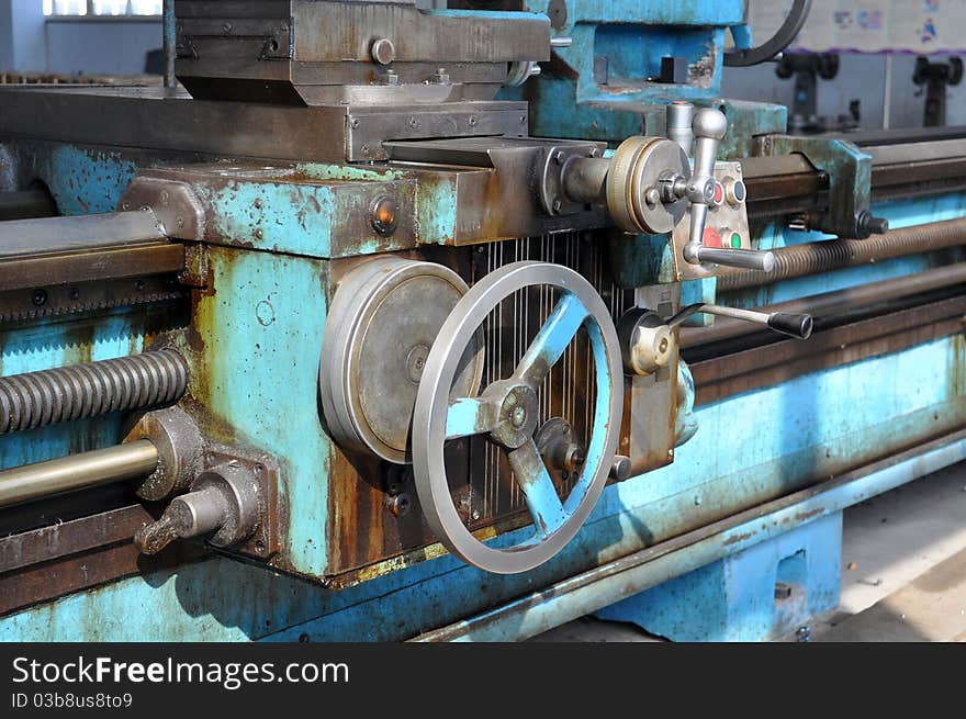 Old metal machines - lathe. Industrial workshop.