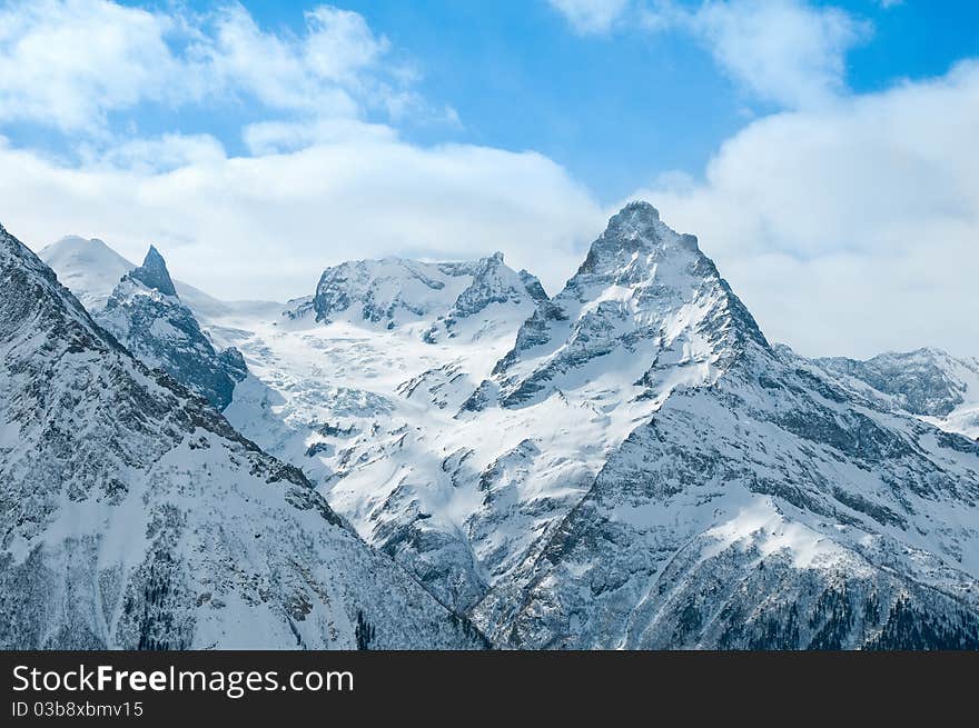 Snow-covered tops of the Caucasian mountains in Russia. Snow-covered tops of the Caucasian mountains in Russia.