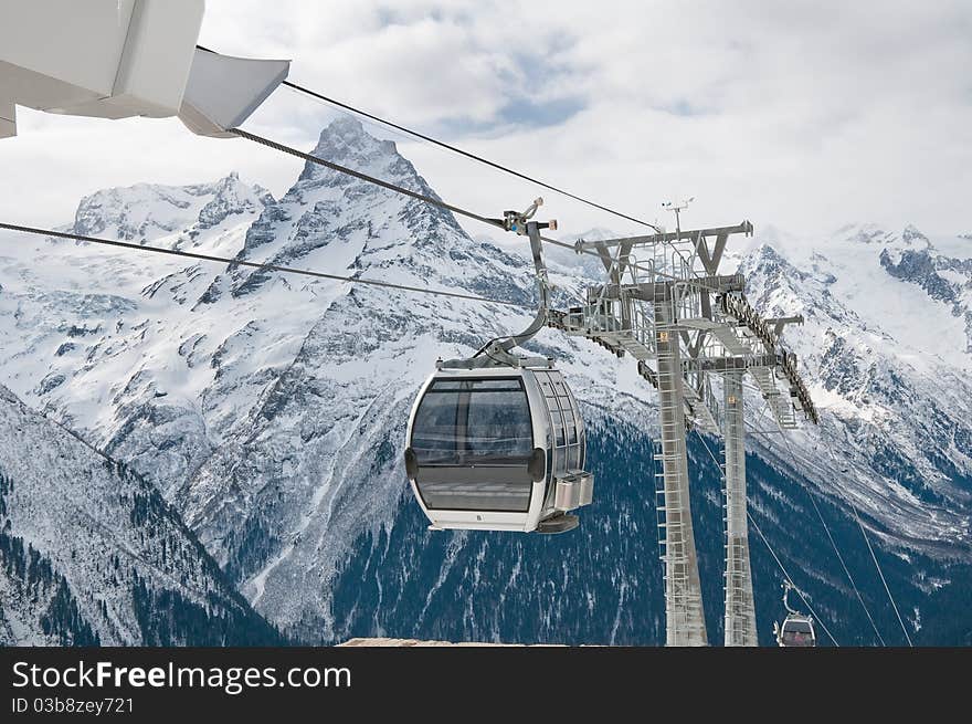 Rope-way on a mounting skiing resort in Russia. Settlement Dombai.The Caucasian mountains. Rope-way on a mounting skiing resort in Russia. Settlement Dombai.The Caucasian mountains.