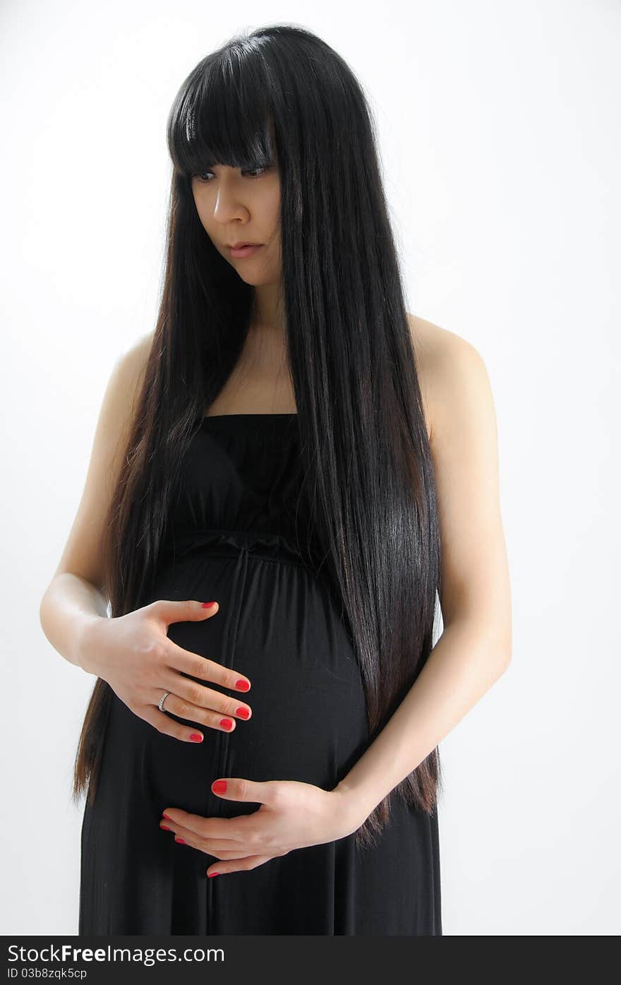 Portrait of asian pregnant woman on white