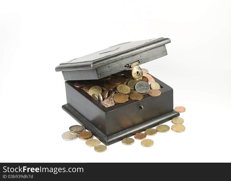 Photo of an old box full with coins