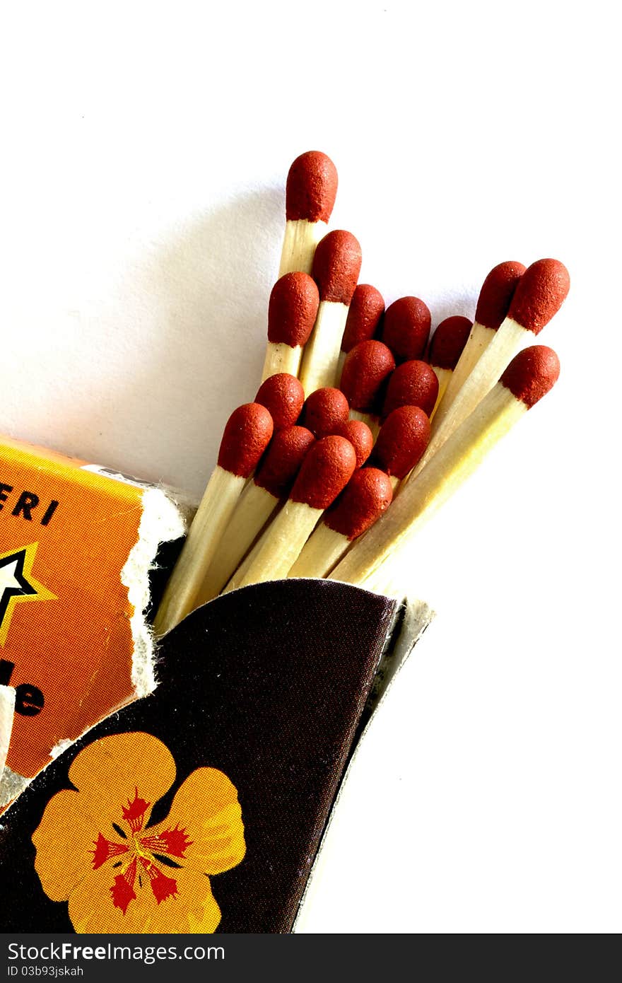 Matches up close on a white background