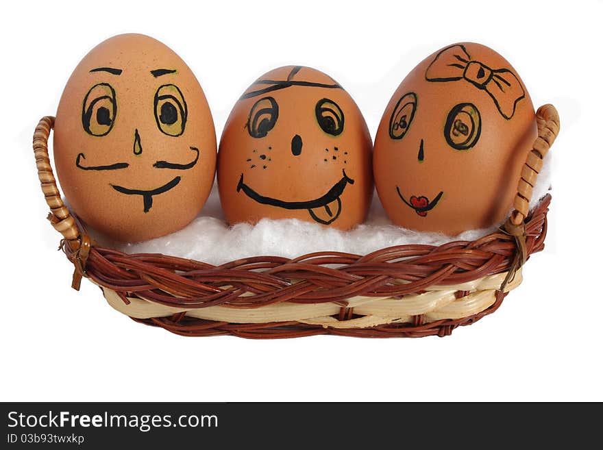 Eggs in a basket with painted faces