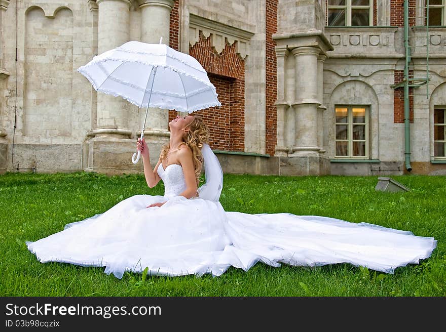 Bride with white umbrella