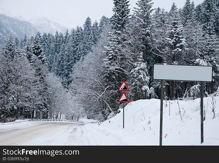 Difficult conditions of mountain road during a snowfall. Difficult conditions of mountain road during a snowfall.