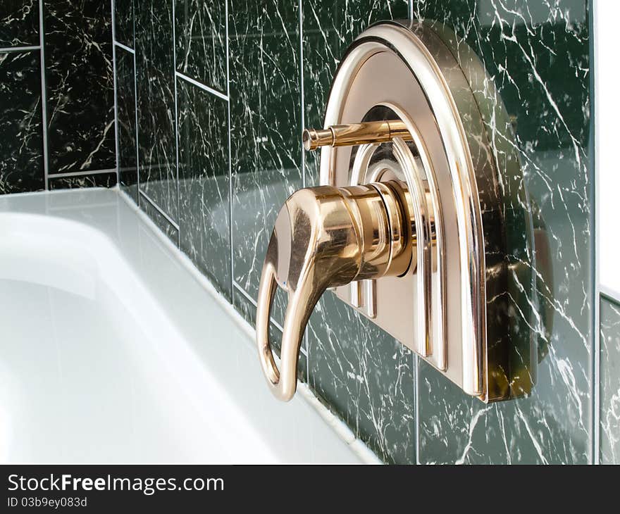 Water tap in a luxurious bathrom for the bath. Water tap in a luxurious bathrom for the bath