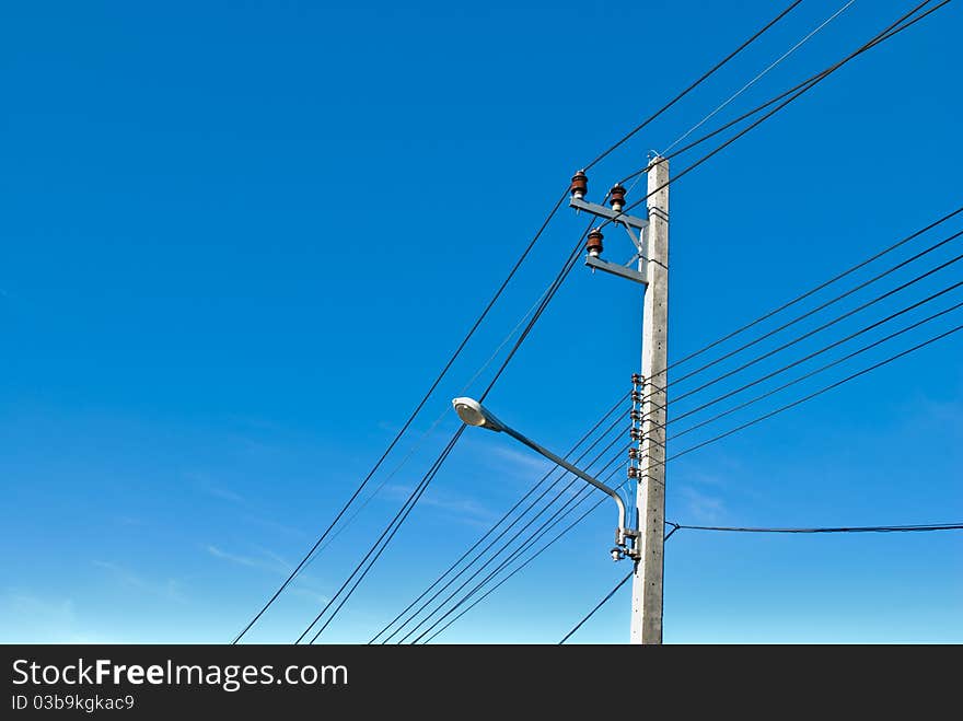 Electricity post with blue sky