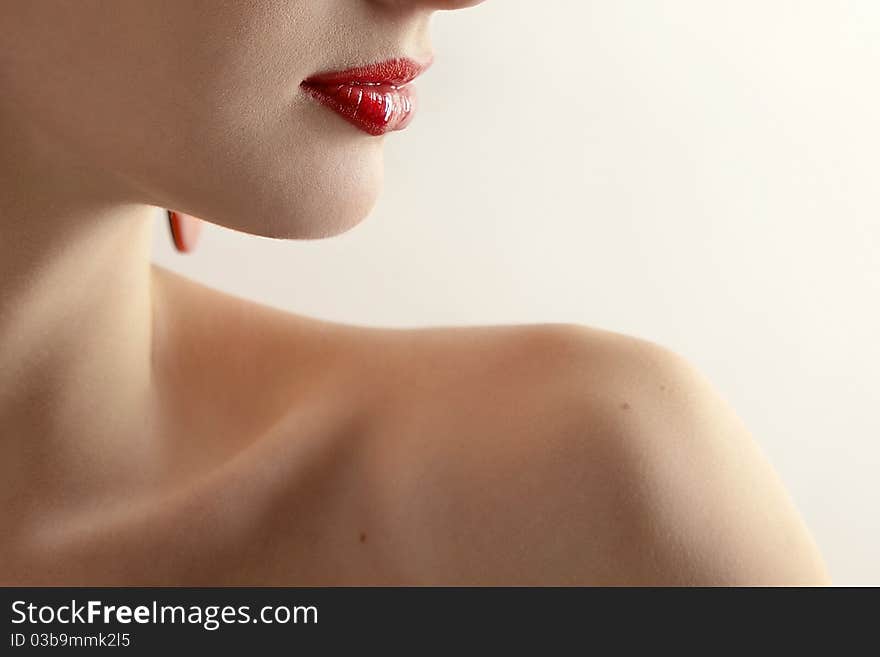 Portrait of a beautiful young woman close-up on a light background. Portrait of a beautiful young woman close-up on a light background