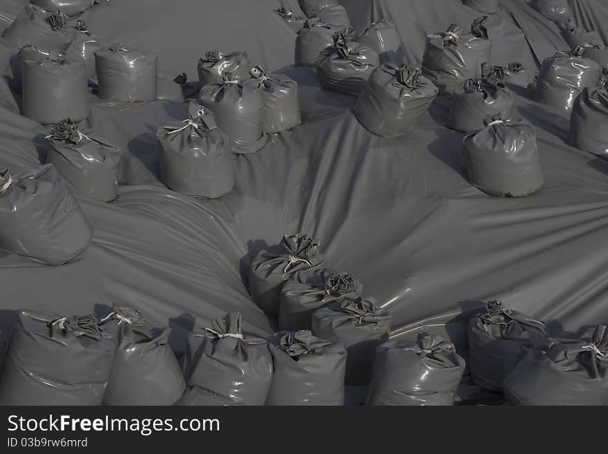 Plastic sheets and plastic sandbags protecting an ancient ruin. Plastic sheets and plastic sandbags protecting an ancient ruin