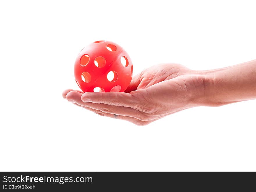 Hand Holding a Red Whistle Ball