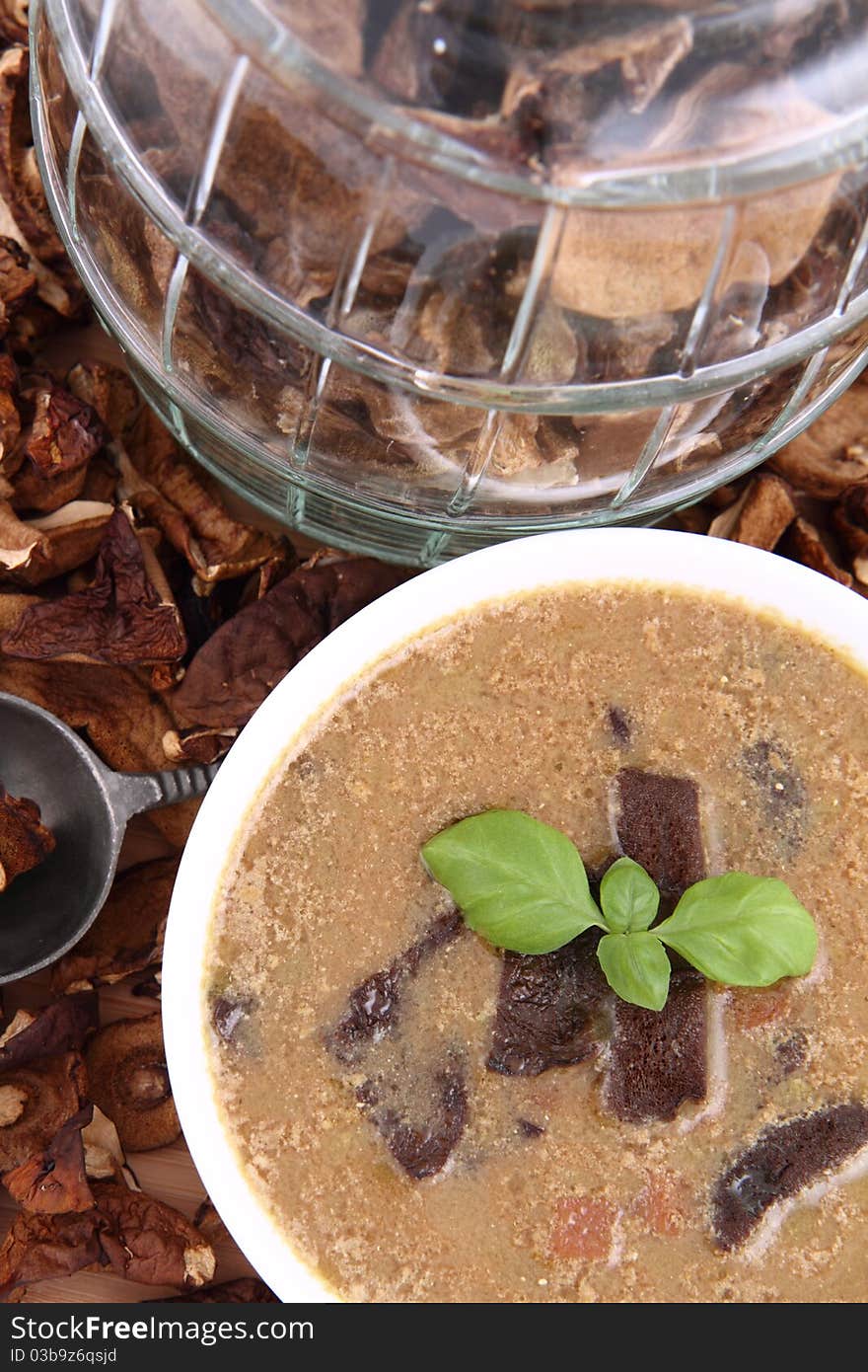 Mushroom soup, dried mushrooms and an antique spoon