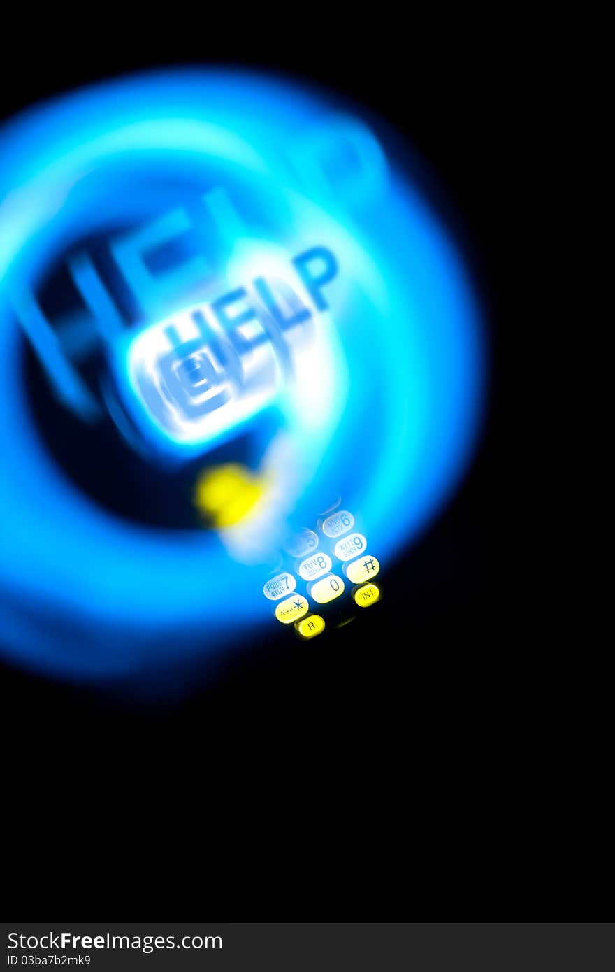 Dect phone with text HELP and blue and yellow light traces. Dect phone with text HELP and blue and yellow light traces