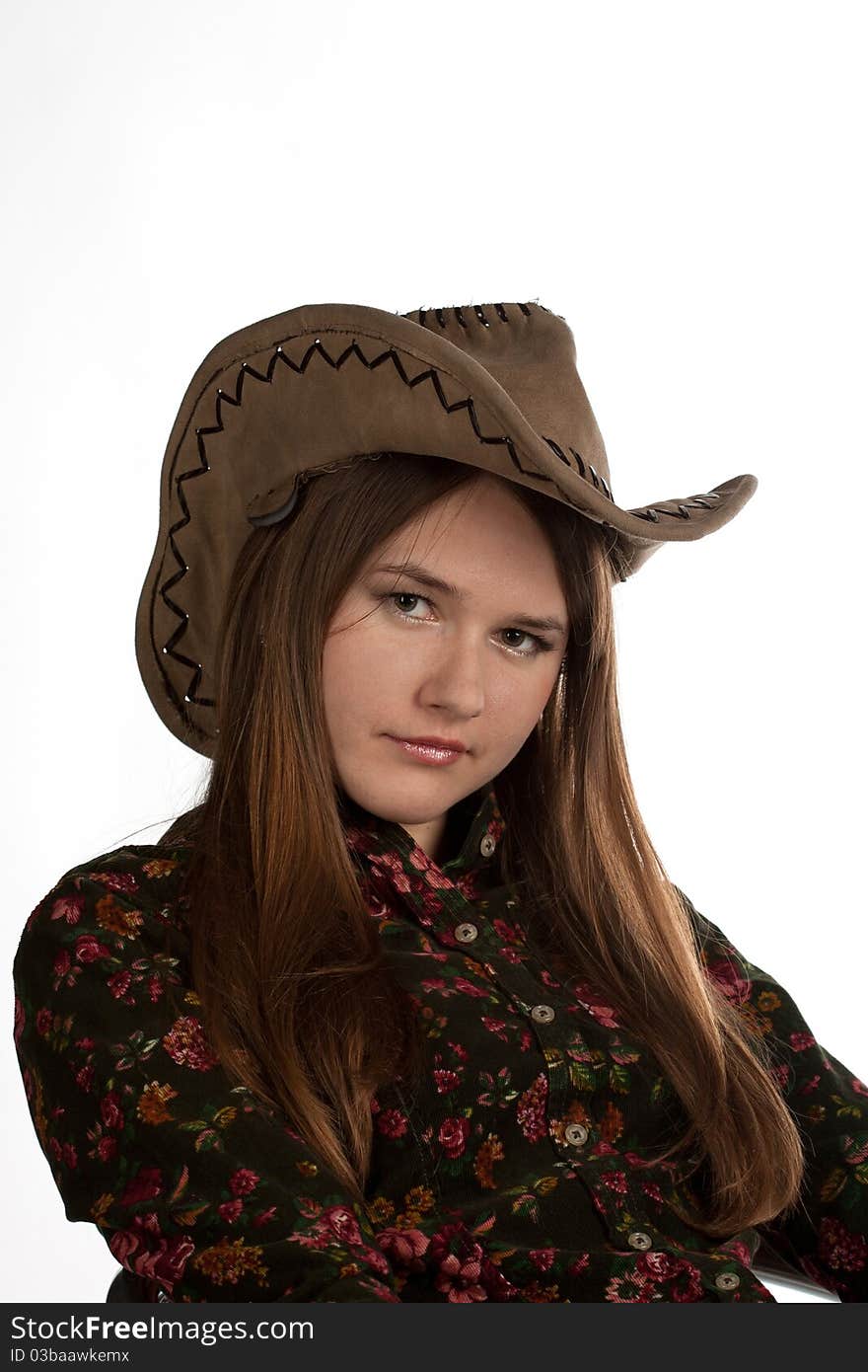 Attractive cowgirl portrait on white background