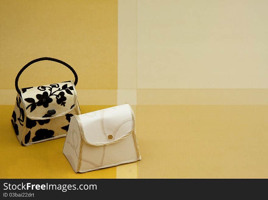 Two purses on a gold background perfect for inviting people to a shopping party at your house. Two purses on a gold background perfect for inviting people to a shopping party at your house.