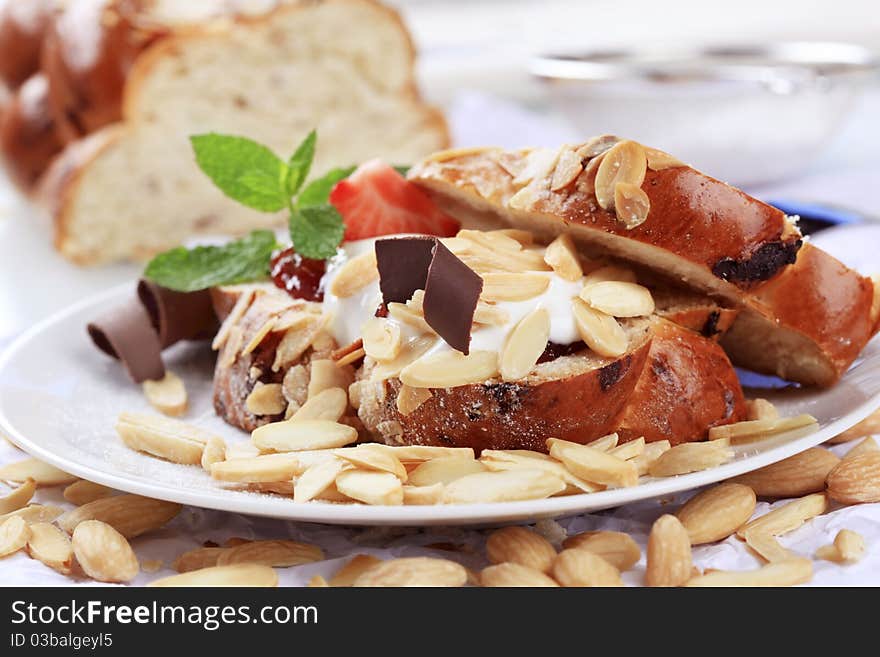 Sweet bread with jam, cream cheese and almonds. Sweet bread with jam, cream cheese and almonds