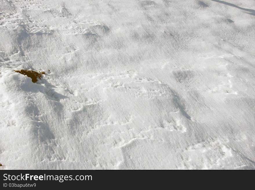 Surface of a snowy field.