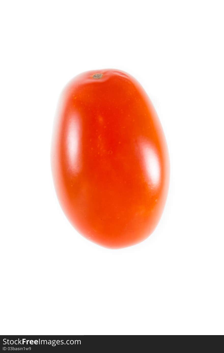 One single red cherry tomatoe over white background. One single red cherry tomatoe over white background.