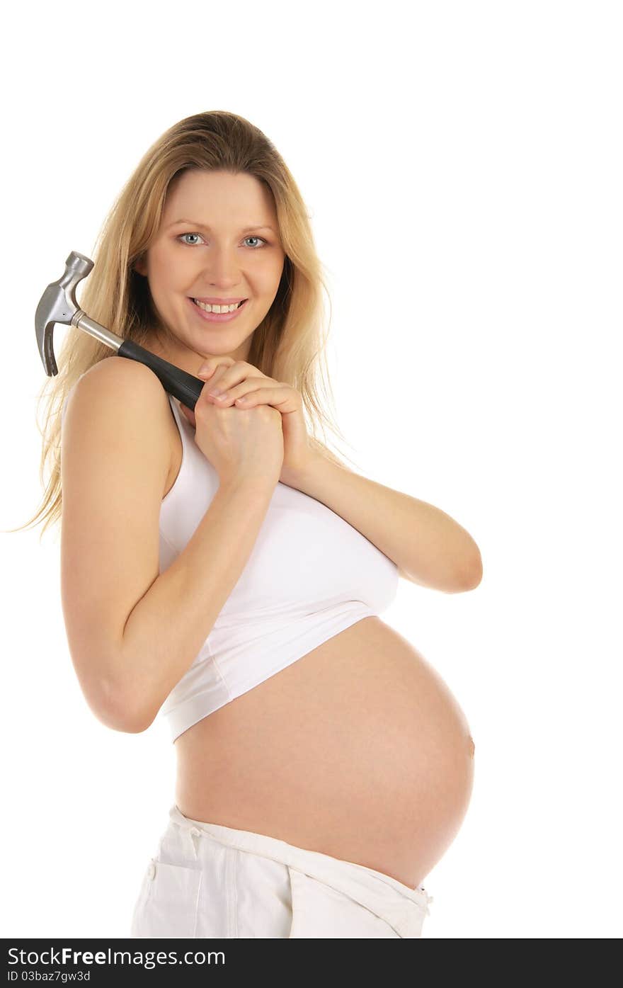 Happy pregnant woman with a hammer