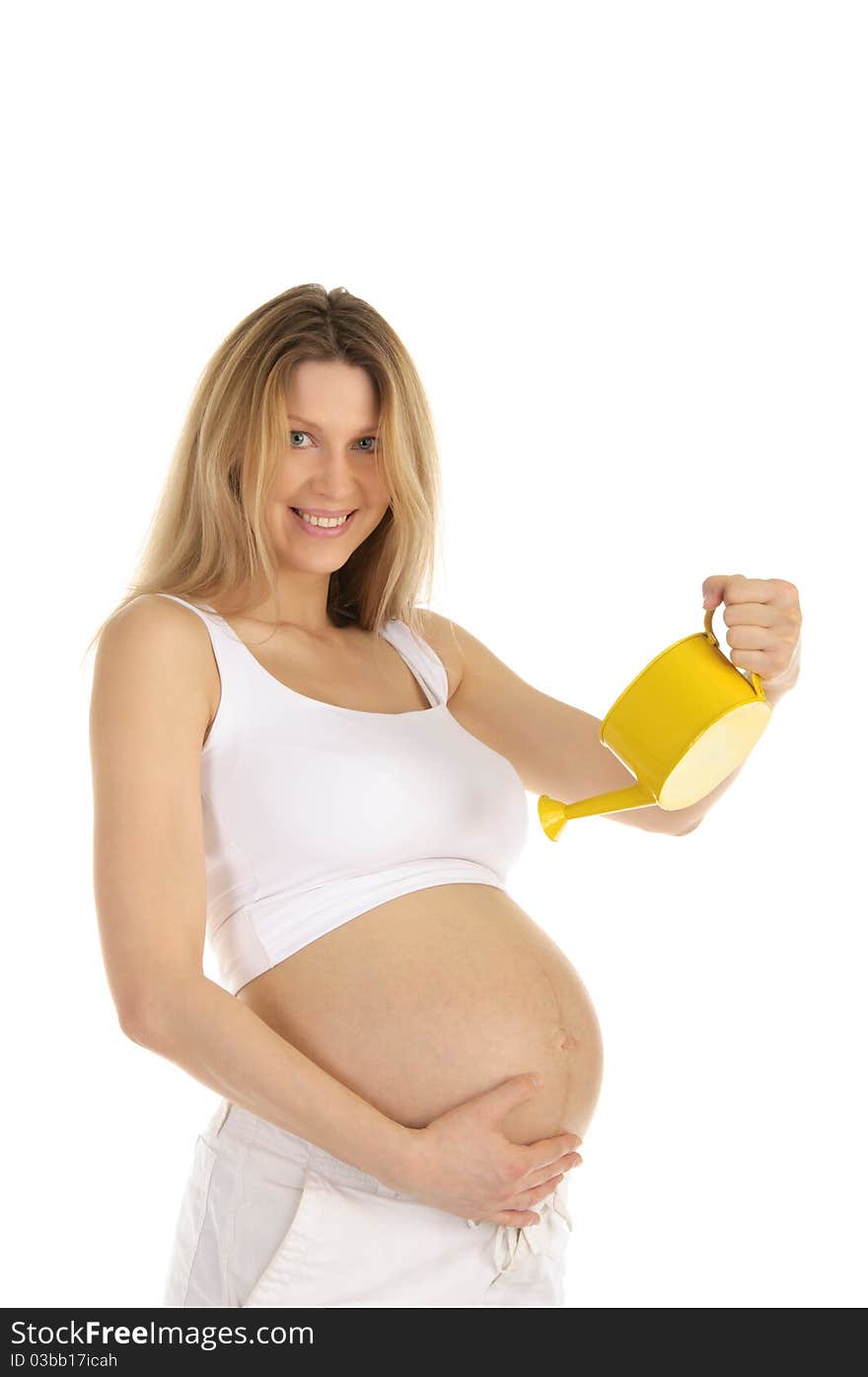 Pregnant woman watering her belly