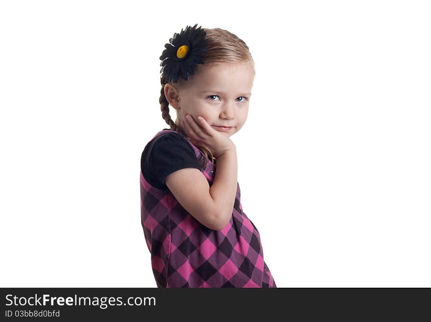 A curt girl standing a little slanted with her arm under her chin.  She has a laid back but serious look on her face. A curt girl standing a little slanted with her arm under her chin.  She has a laid back but serious look on her face.