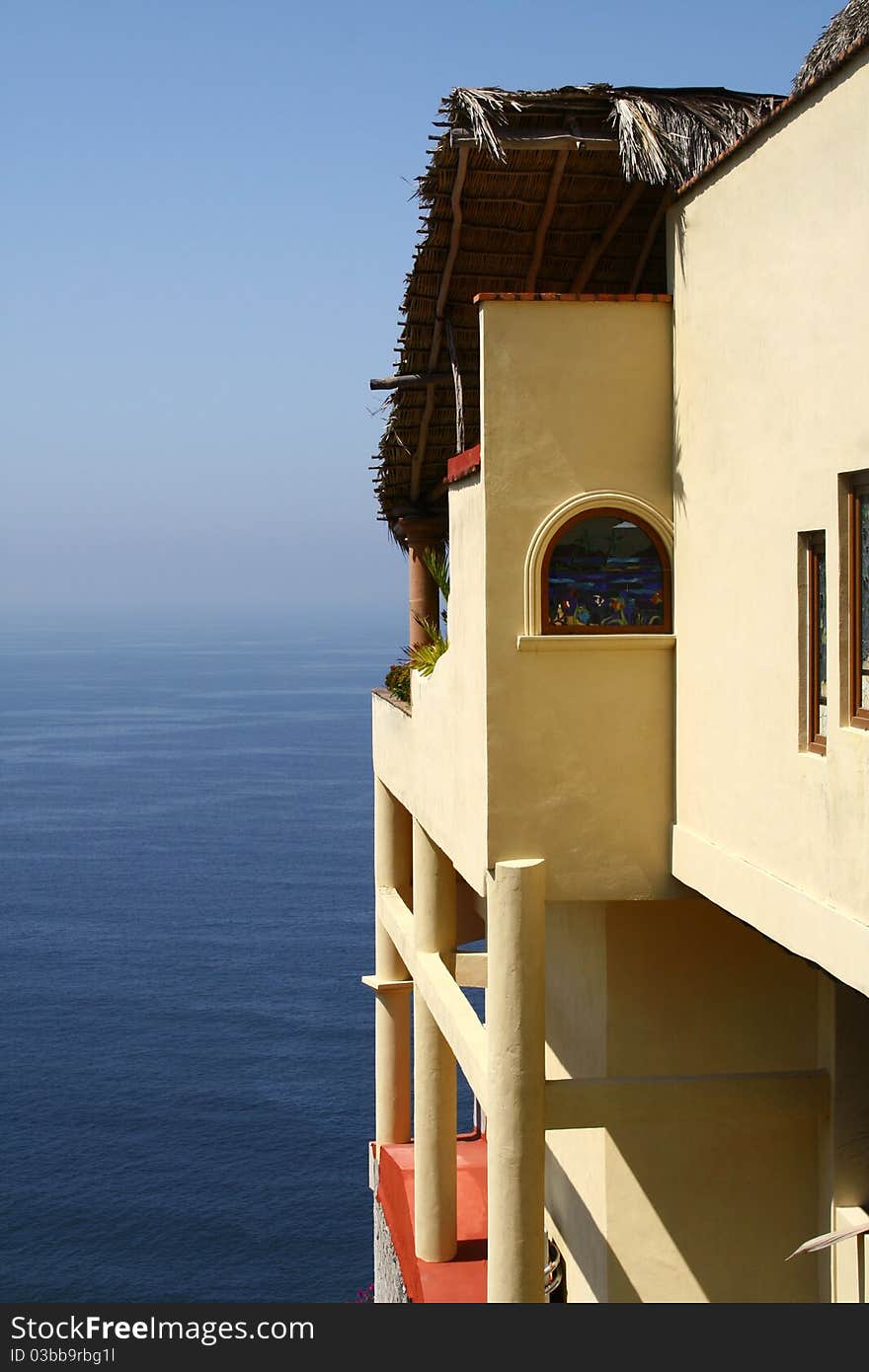 A home on a cliff overlooking the ocean. A home on a cliff overlooking the ocean