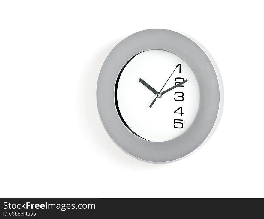 Grey and white wall clock on white background.