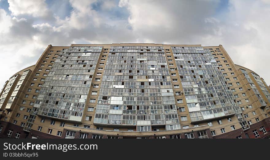 An apartment high-rise building of yellow brick. An apartment high-rise building of yellow brick