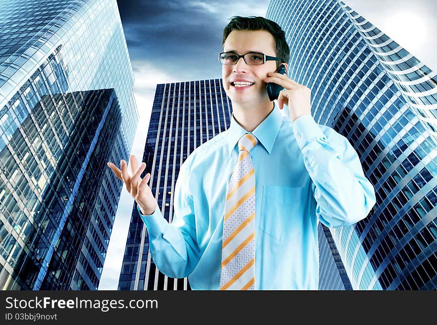 Hapiness Businessman standing on the business background. Hapiness Businessman standing on the business background