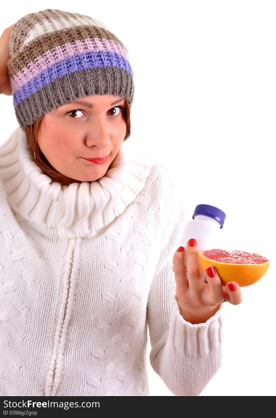 Sick Young woman with fruit and pills in her hand