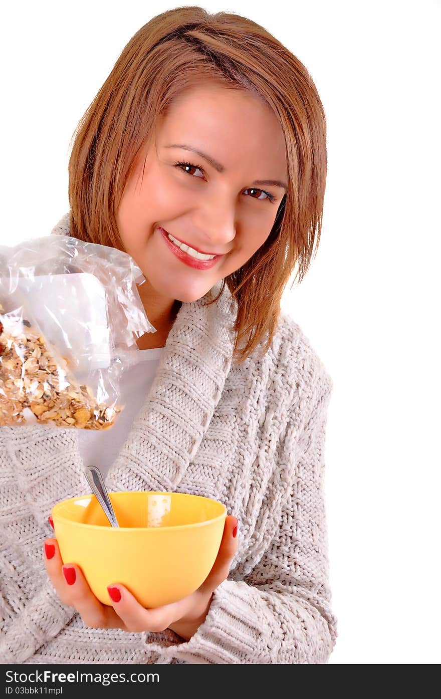 Happy young woman eating cereals