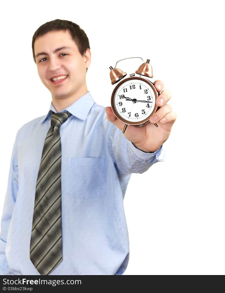 Businessman with an alarm clock in a hand. Isolated on white background