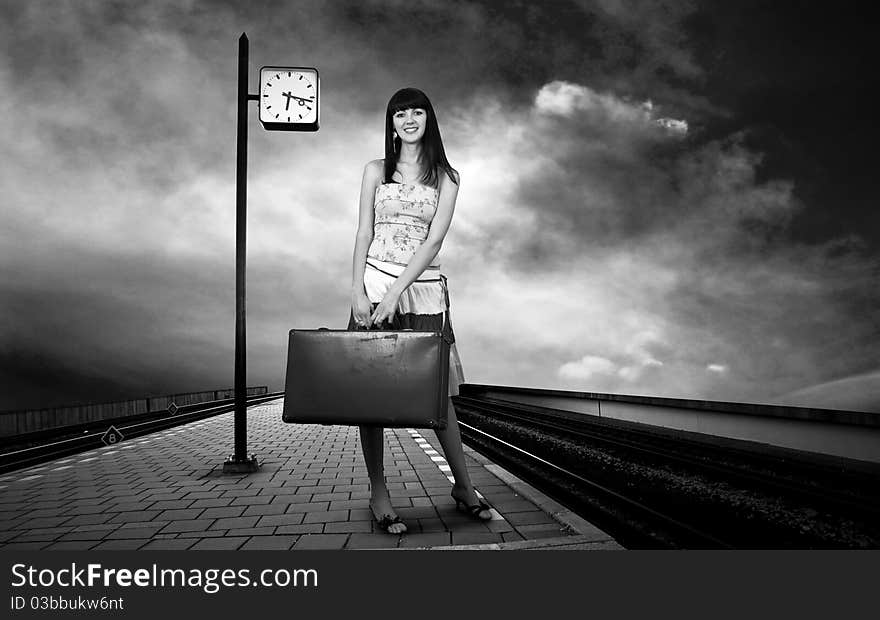 Woman waiting train on the platform of railway station. Woman waiting train on the platform of railway station