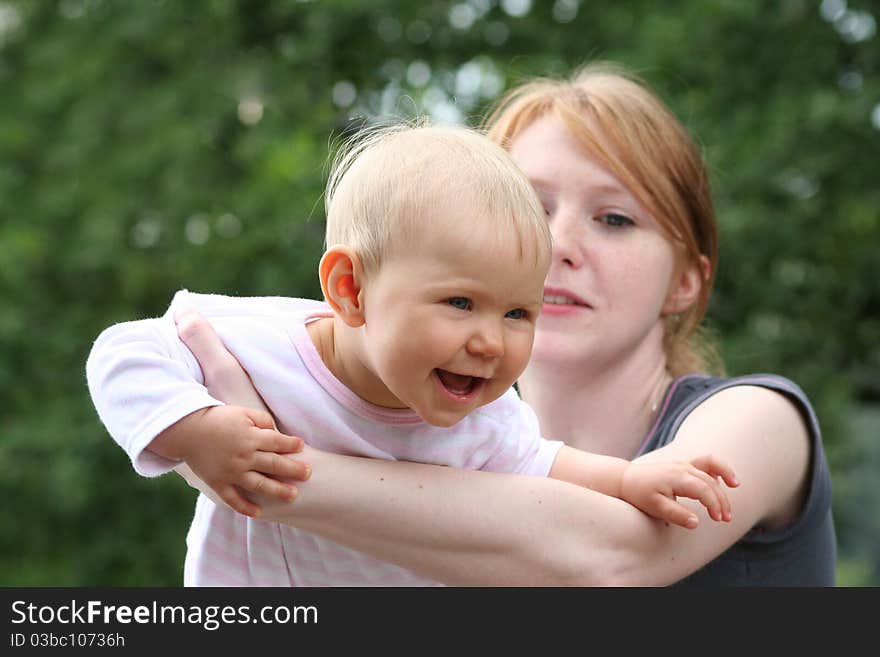 Children and mother playing outdoors