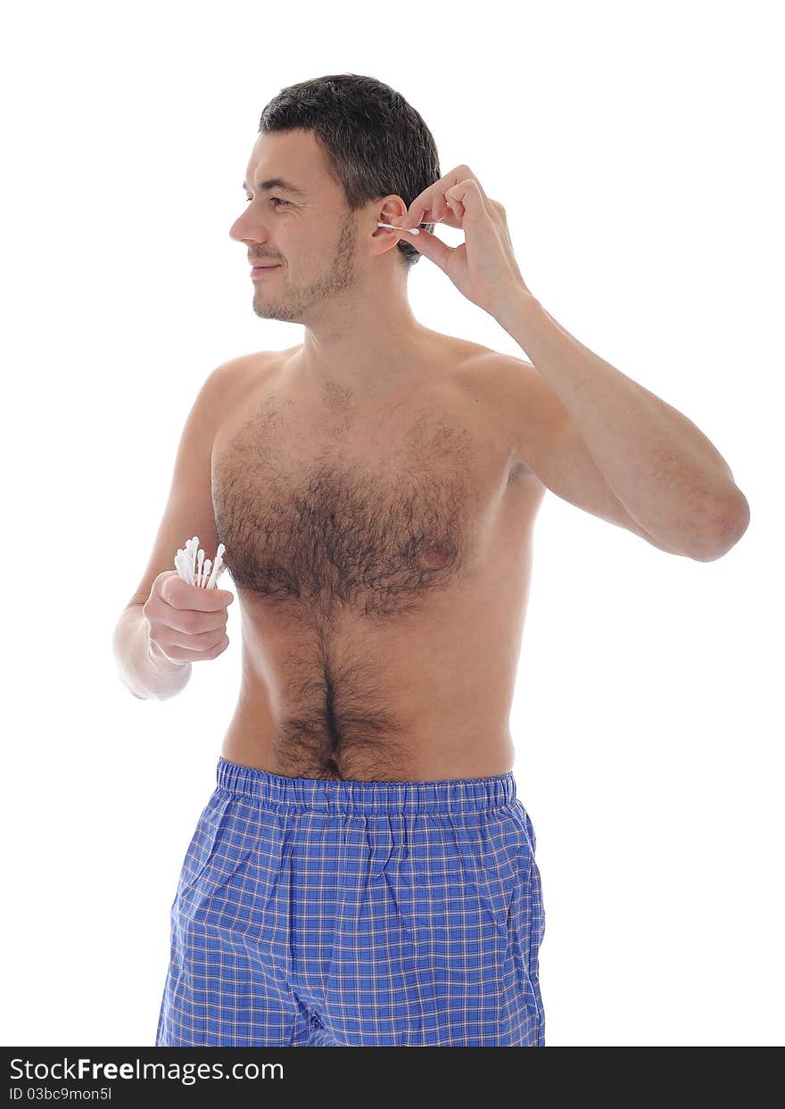 Handsome young man cleaning ears with cotton pad stick. isolated on white background. Handsome young man cleaning ears with cotton pad stick. isolated on white background