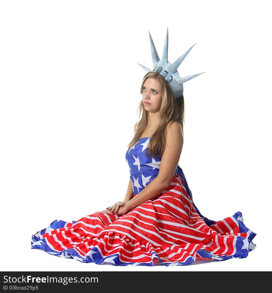 Attractive blond woman in costume Statue of Liberty