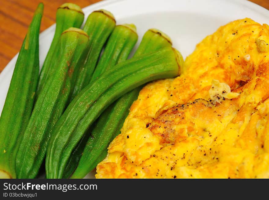 Simple dish of okra and fried omelet as side dishes. Simple dish of okra and fried omelet as side dishes.