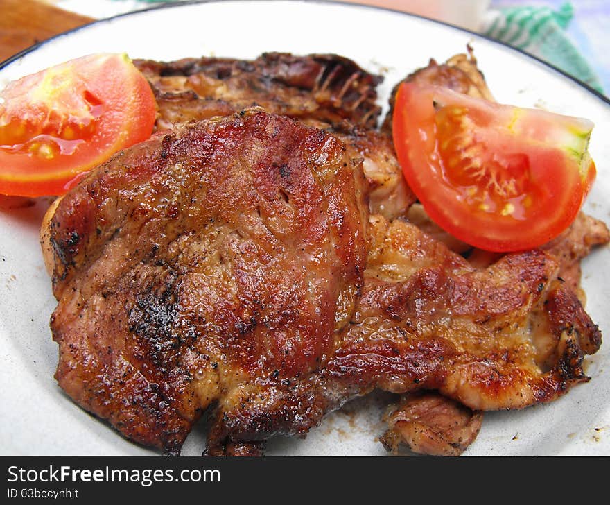 Grilled steak meat with tomatoe. Grilled steak meat with tomatoe