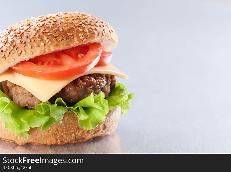 Cheeseburger with tomatoes and lettuce