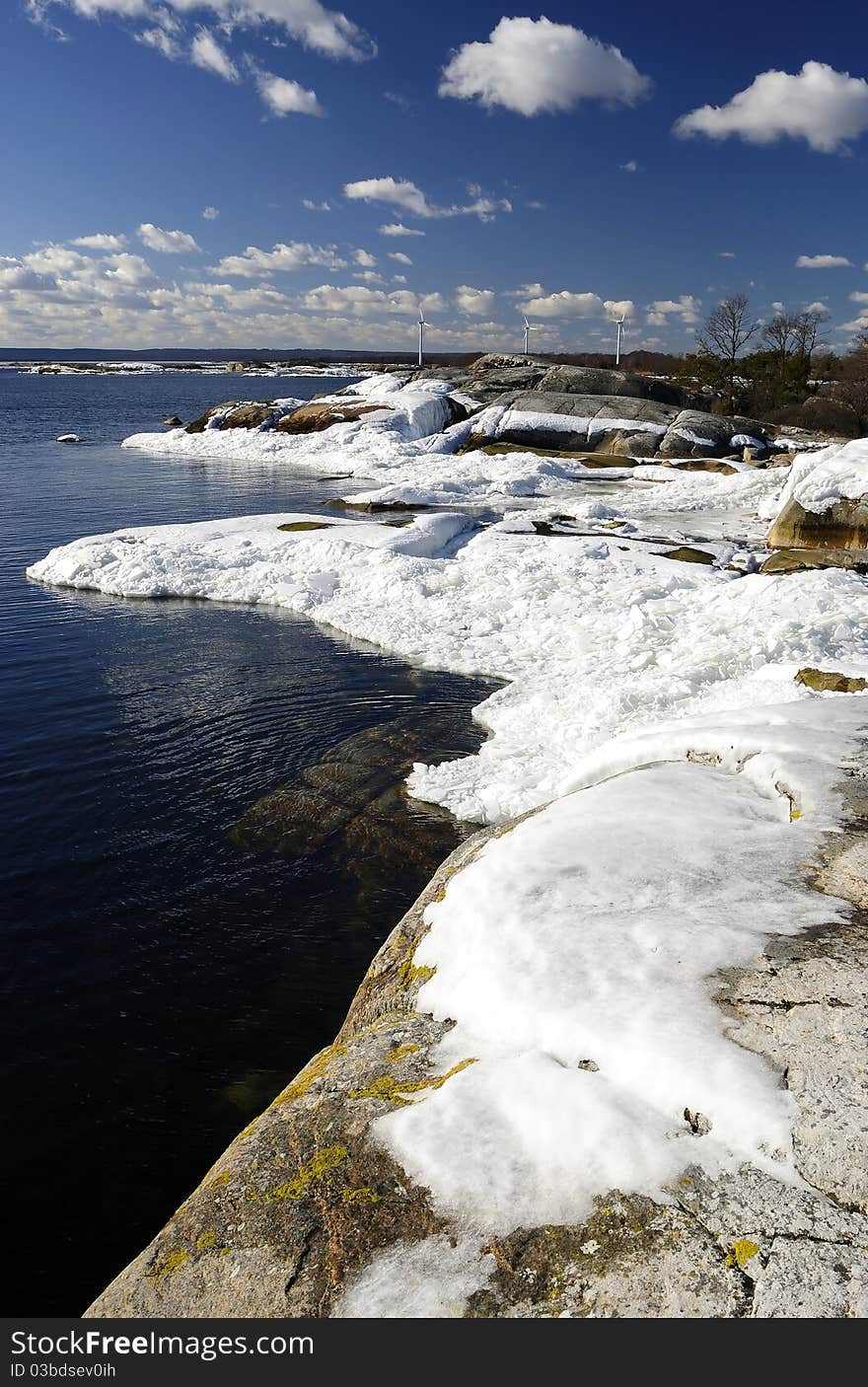 Beautiful spring shore vertical landscape with ice poles. Beautiful spring shore vertical landscape with ice poles