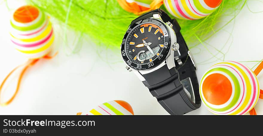 Easter watch with nest and eggs on white