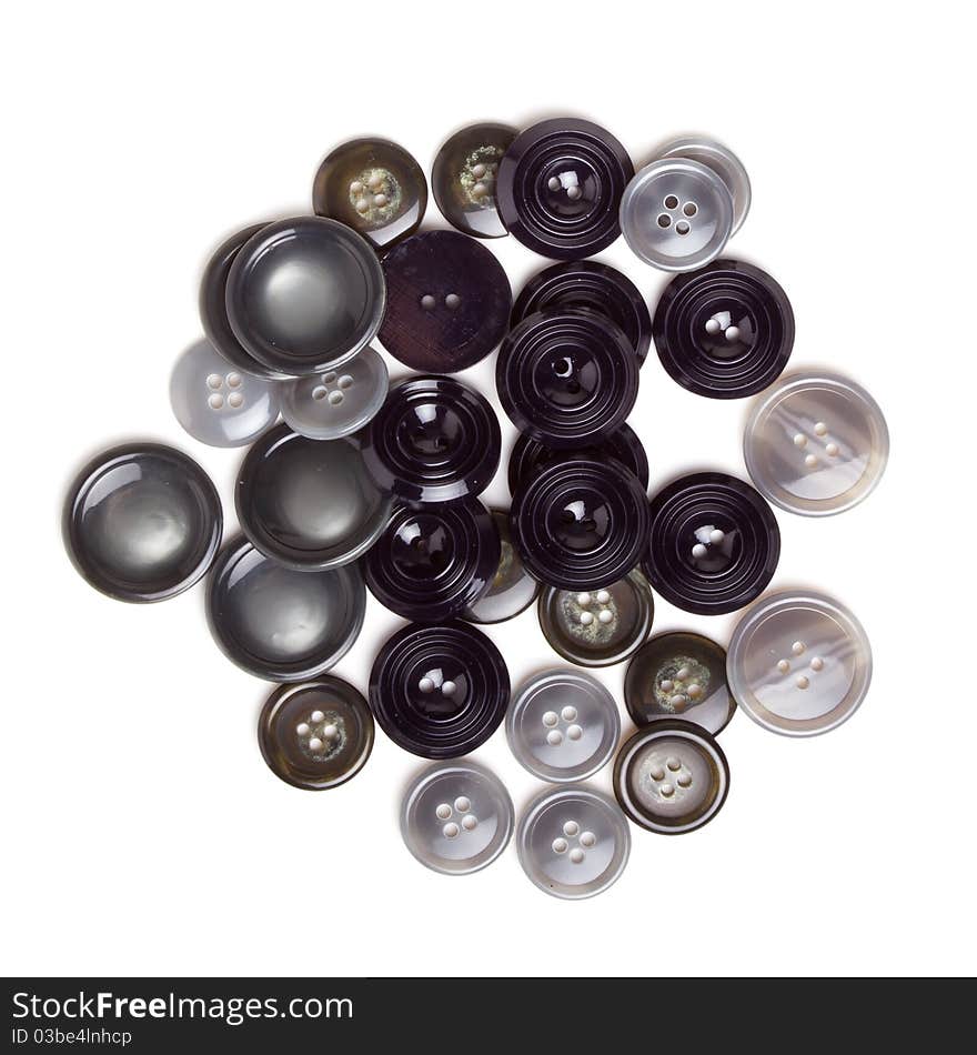 Pile of Vintage buttons from overhead isolated on white.