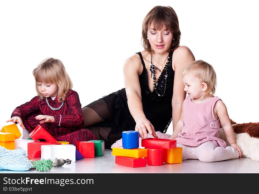 Children with mother playing with blocks