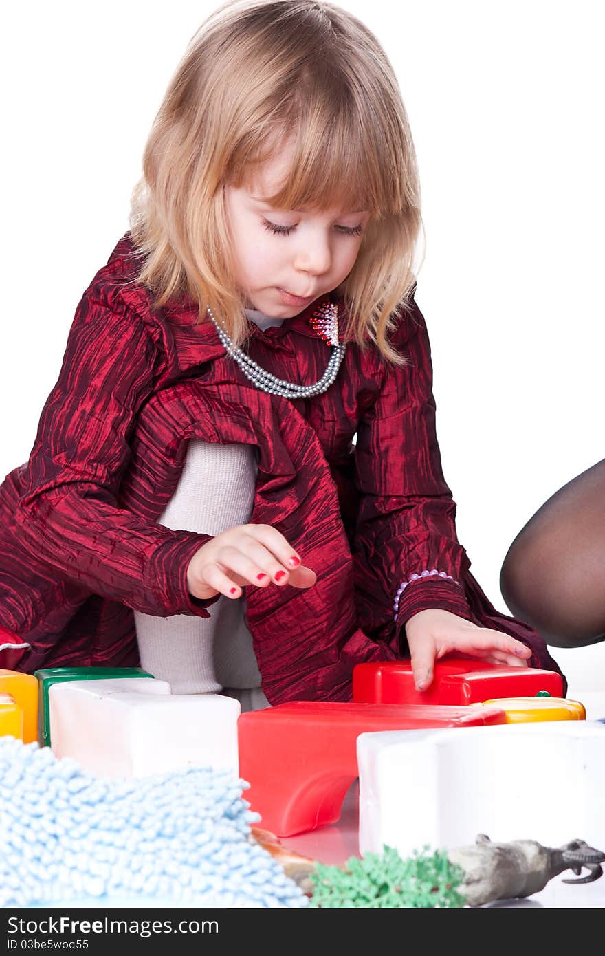 Child playing with blocks isolated on white