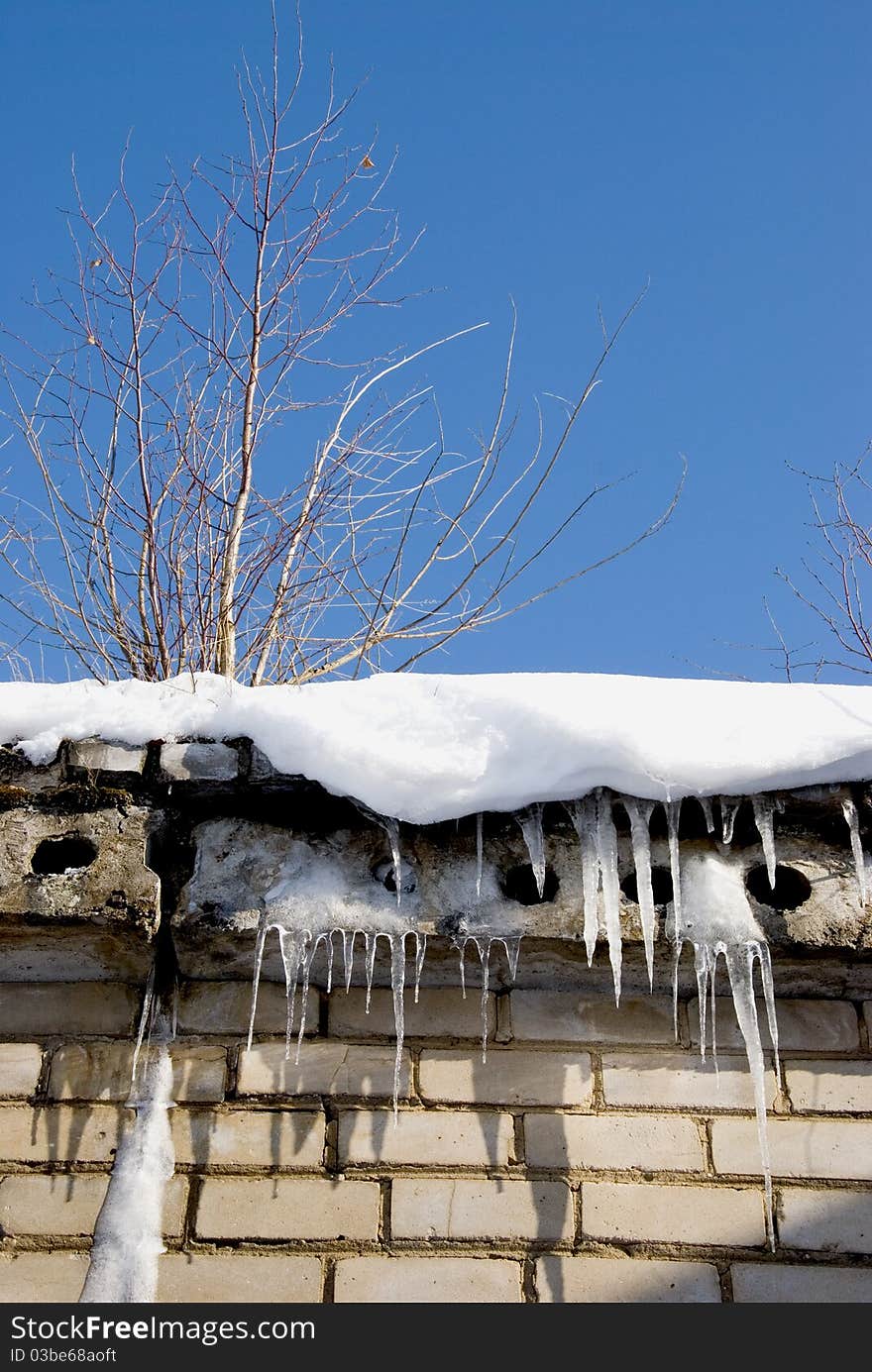 Icicles And Root On The Roof