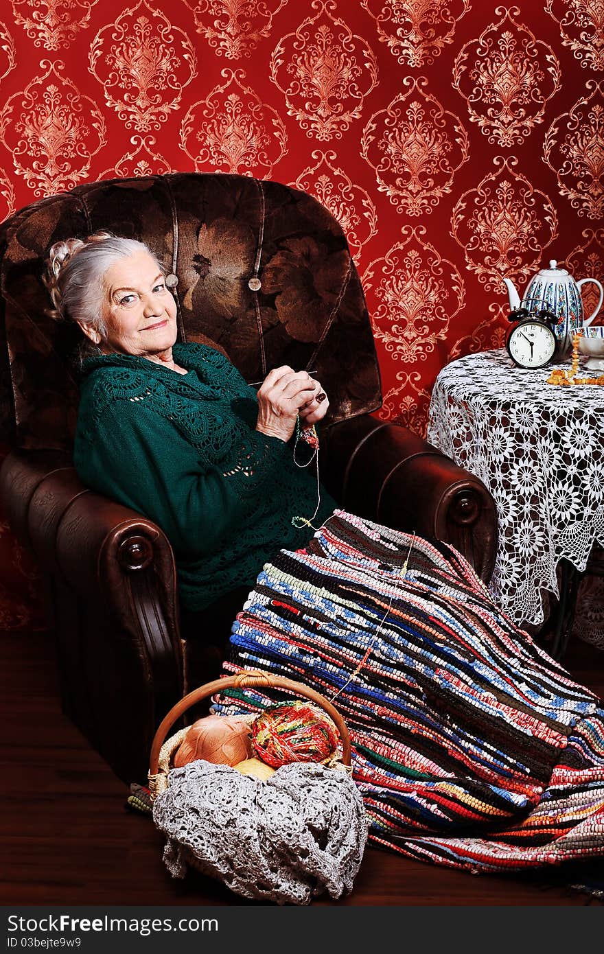 Portrait of a smiling senior woman having a rest at home.