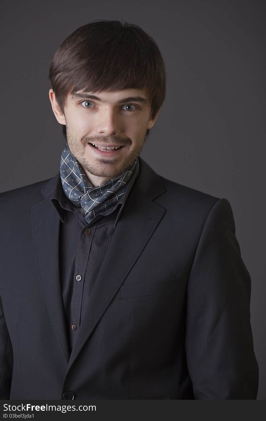 Portrait of happy fashion man in business suit